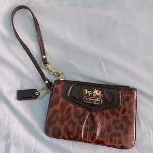 Authentic Coach Cheetah Print Wristlet with zipper. Perfect for cash/cards.